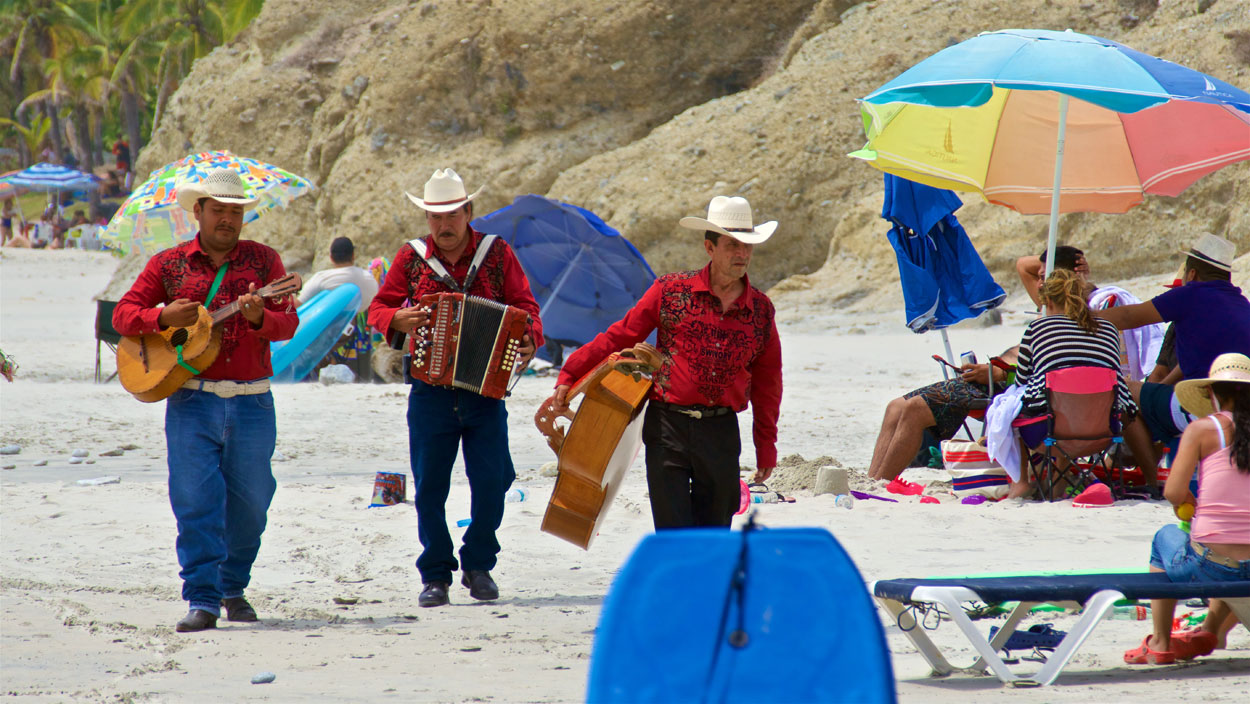 Even on a warm day, you can expect the occasional musical troupe hoping to make a few pesos on the beach.